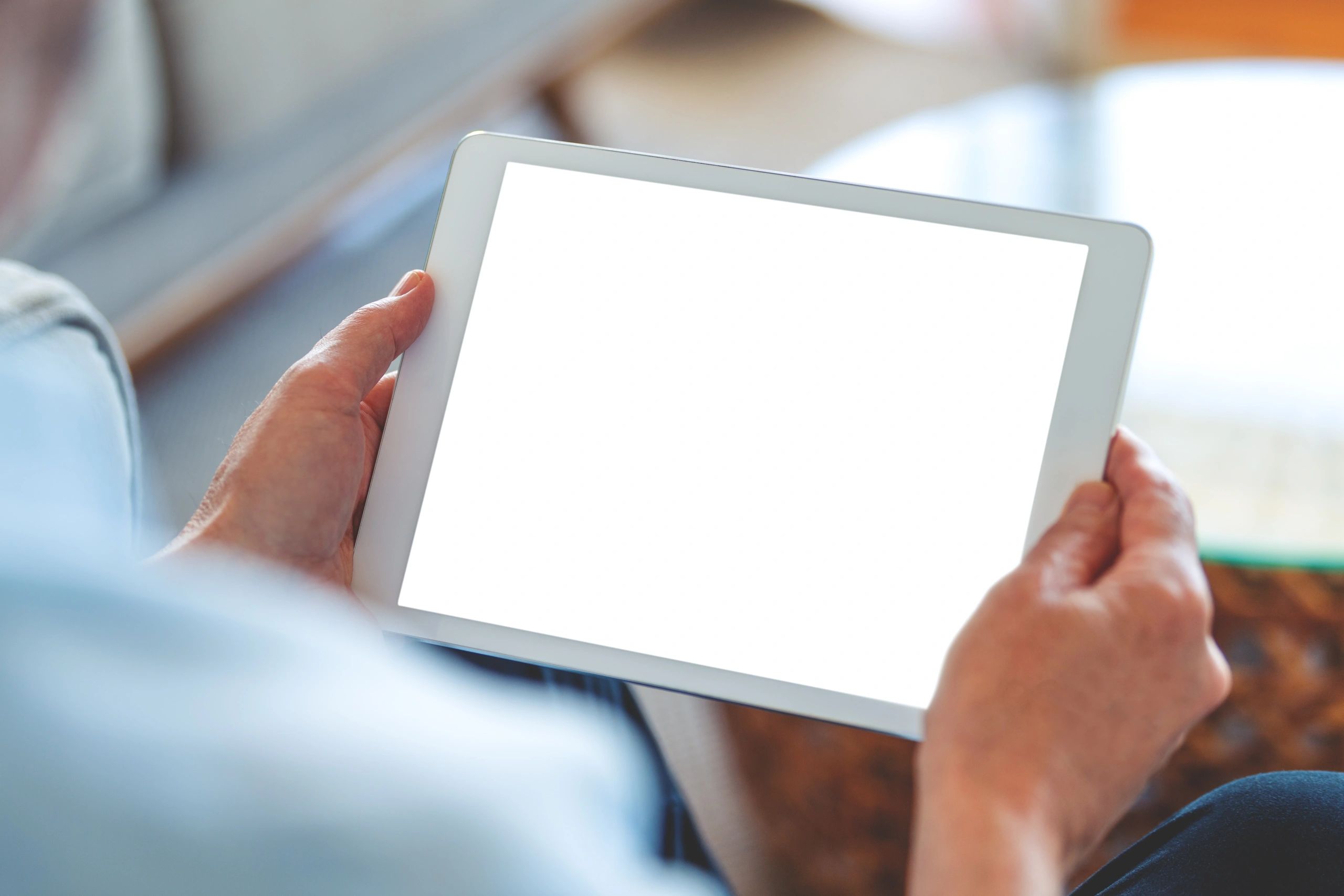 Man using a tablet to access digital reading content